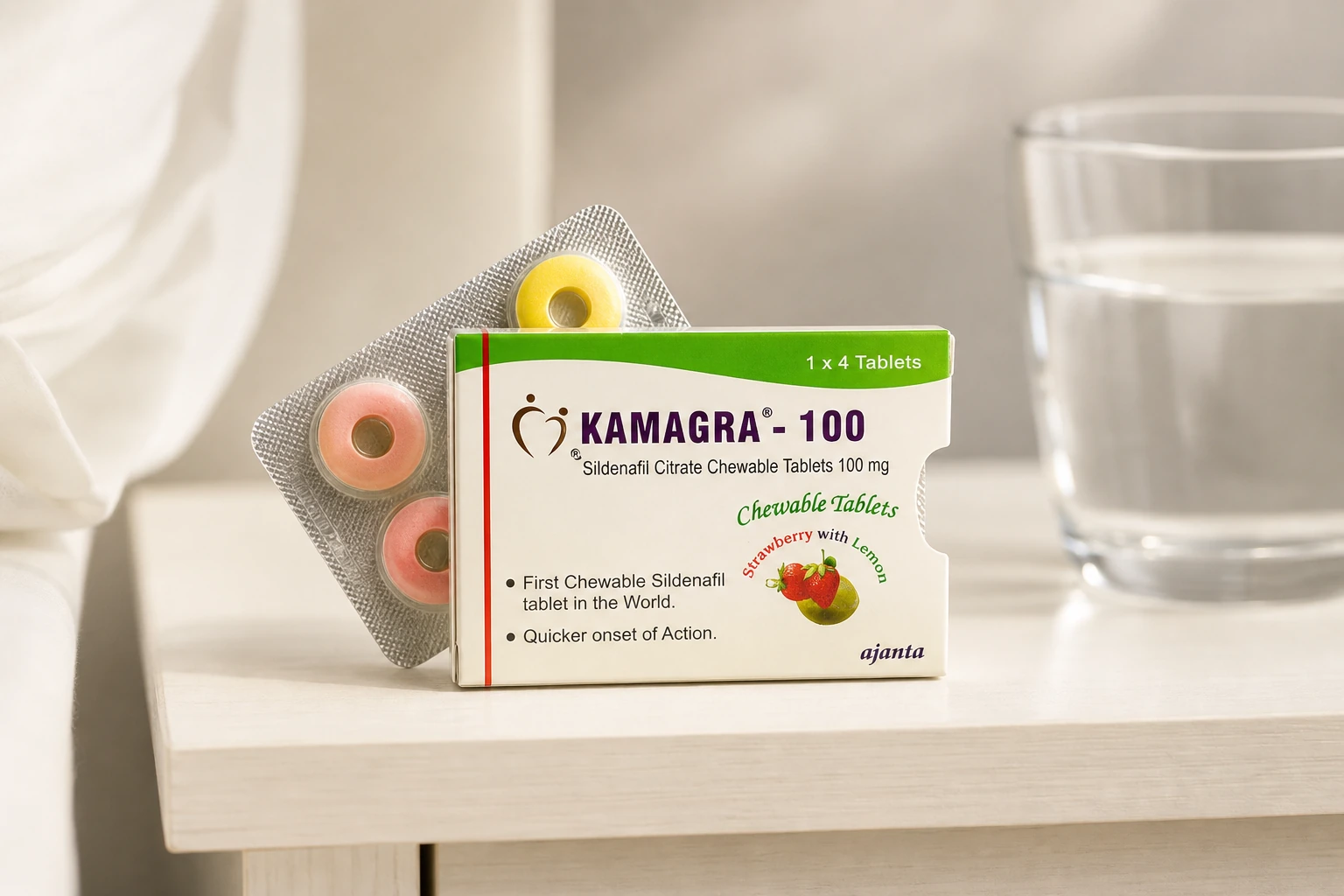 Kamagra-100 chewable tablet carton and blister beside water on a light shelf