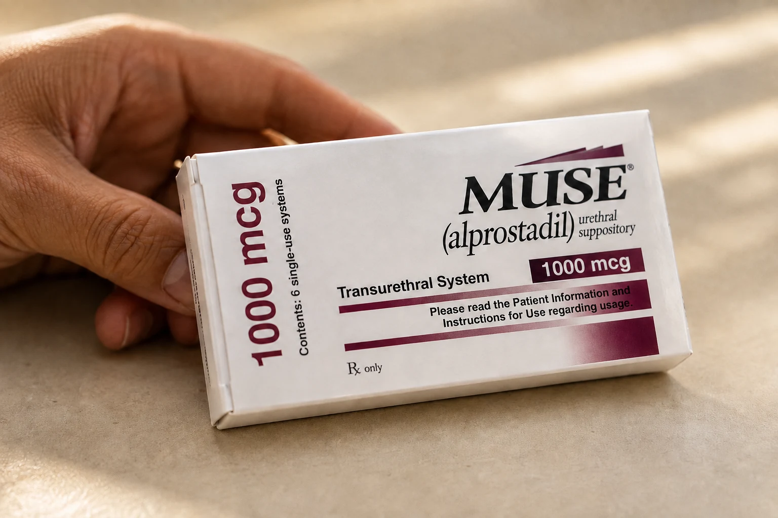 MUSE alprostadil carton with burgundy markings beside an adult hand