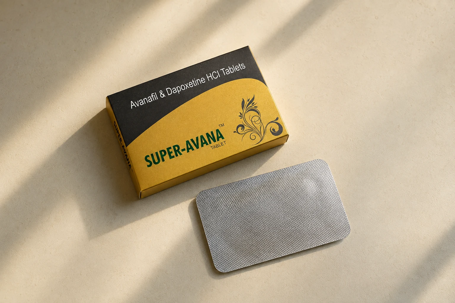 Super Avana carton and sealed blister on a cream surface